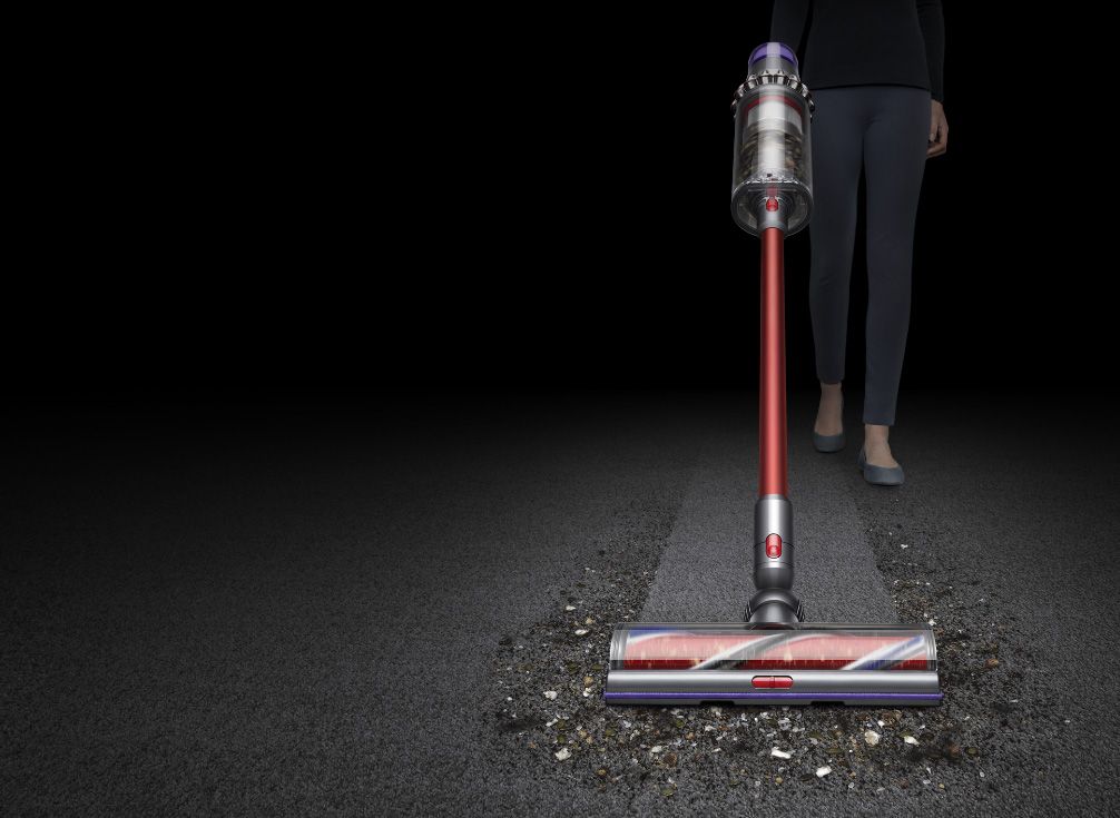  Dyson Outsize vacuum side view cleaning carpet